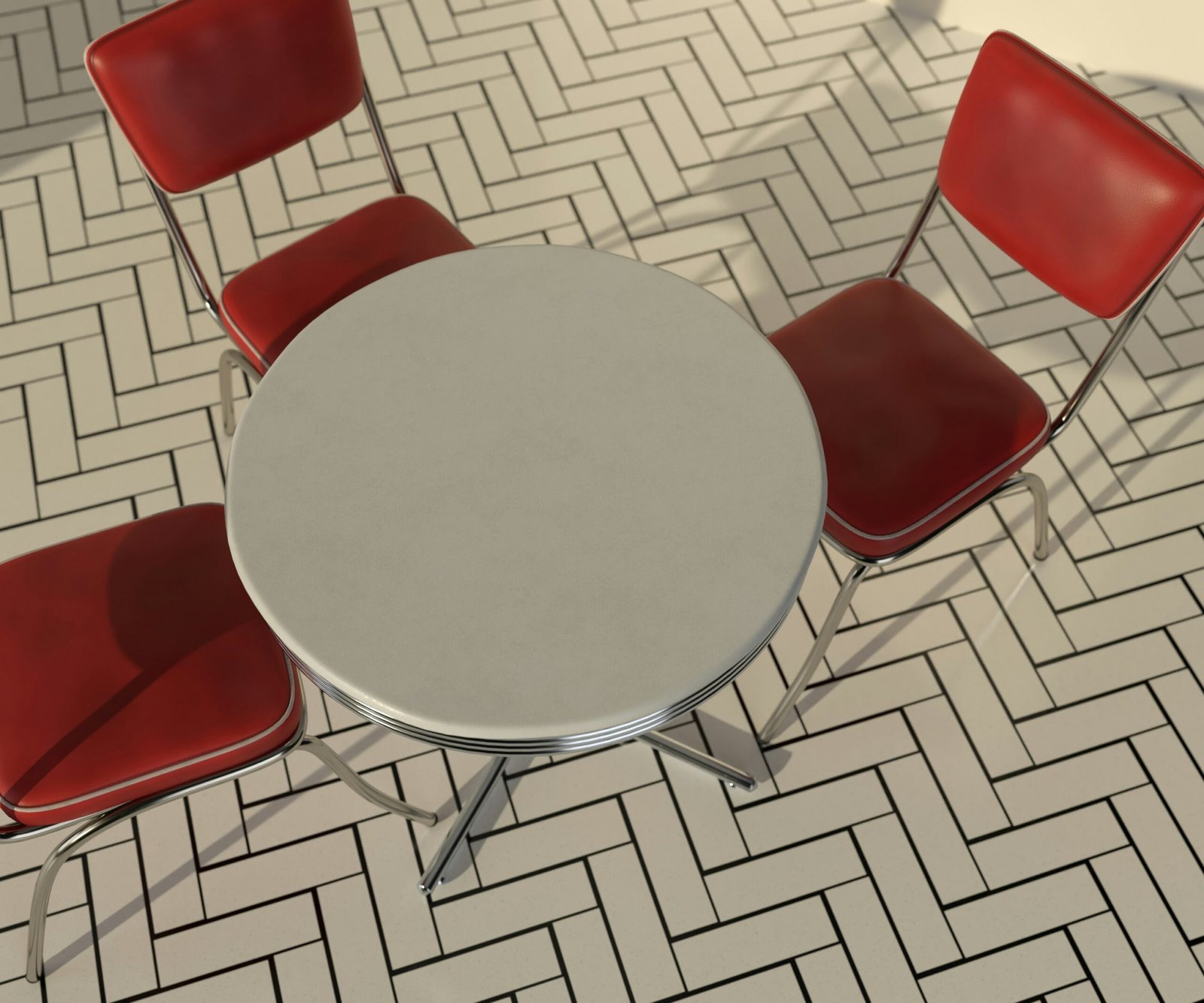 a round table with four red chairs around it